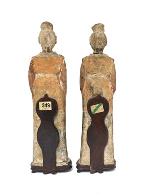 Lot 15 - A pair of Chinese pottery figures