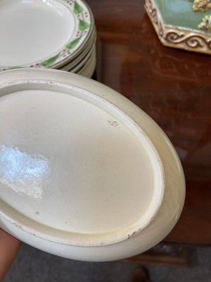 Lot 140 - A large Reilly creamware part dinner service