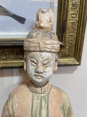 Lot 128 - A pair of Chinese Tang dynasty glazed terracotta burial figures (minggi)