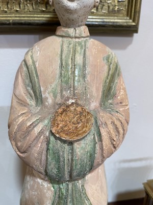 Lot 128 - A pair of Chinese Tang dynasty glazed terracotta burial figures (minggi)