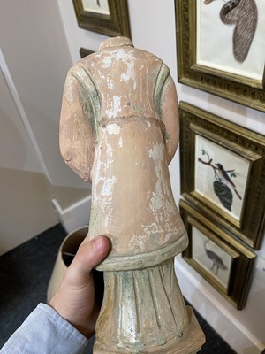 Lot 128 - A pair of Chinese Tang dynasty glazed terracotta burial figures (minggi)