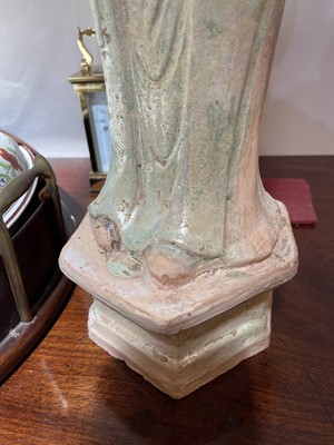 Lot 128 - A pair of Chinese Tang dynasty glazed terracotta burial figures (minggi)