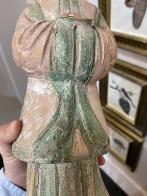 Lot 128 - A pair of Chinese Tang dynasty glazed terracotta burial figures (minggi)