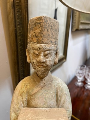 Lot 128 - A pair of Chinese Tang dynasty glazed terracotta burial figures (minggi)