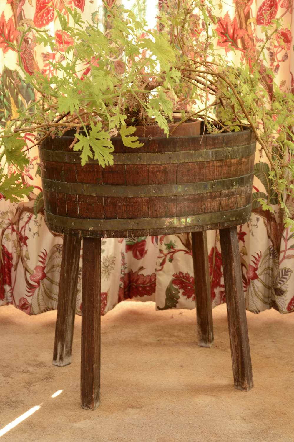 Lot 130 - A coopered oak oval tub or planter