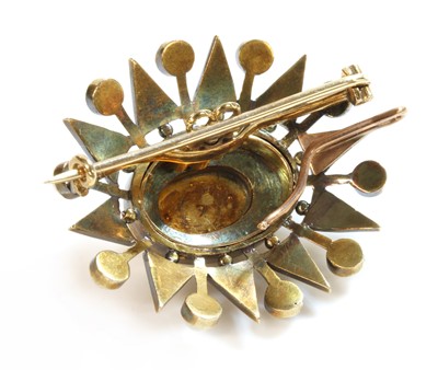 Lot 97 - A Victorian gold split pearl oval starburst brooch/pendant, c.1900