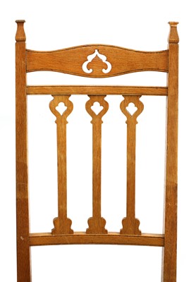 Lot 51 - A set of eight Arts and Crafts oak dining chairs