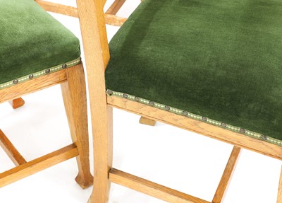 Lot 51 - A set of eight Arts and Crafts oak dining chairs