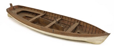 Lot 675 - A wooden model rowing boat
