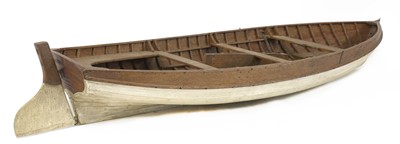 Lot 675 - A wooden model rowing boat