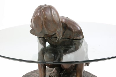 Lot 594 - A contemporary bronze and glass 'She'll Find' coffee table