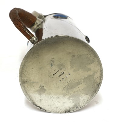 Lot 59 - A Liberty Tudric pewter and enamel jug