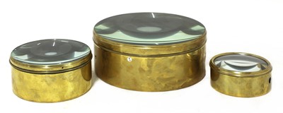 Lot 771 - A set of three graduated brass-bound magic lantern condenser lenses