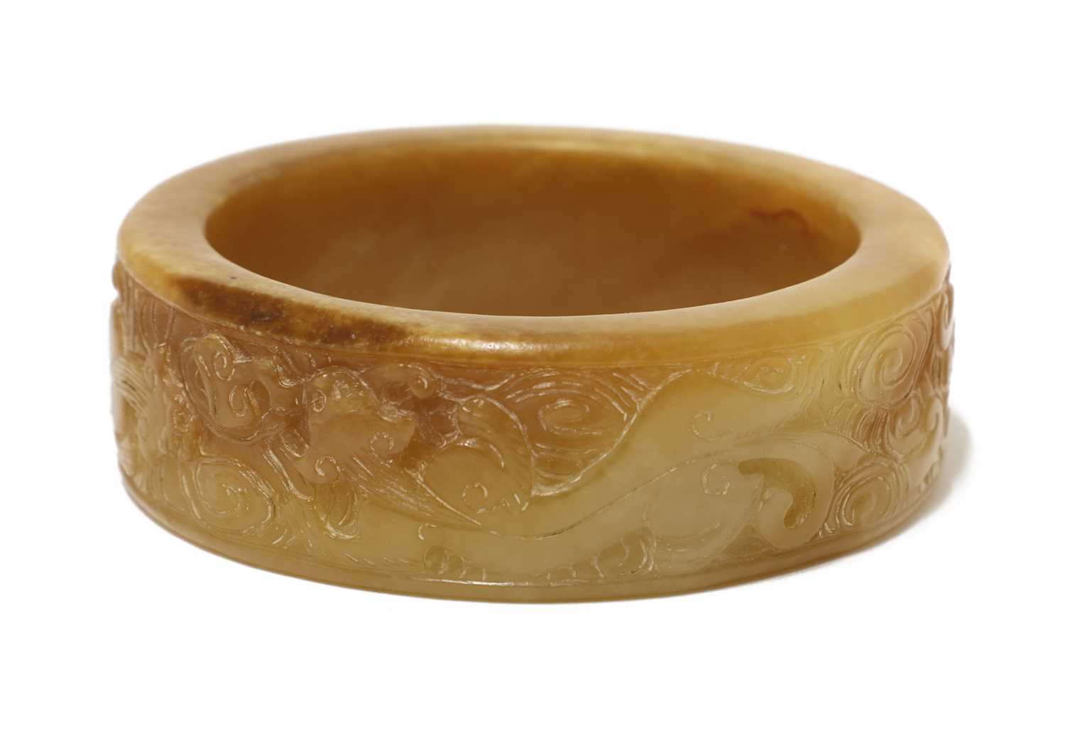 Lot 100 - A Chinese jade bangle