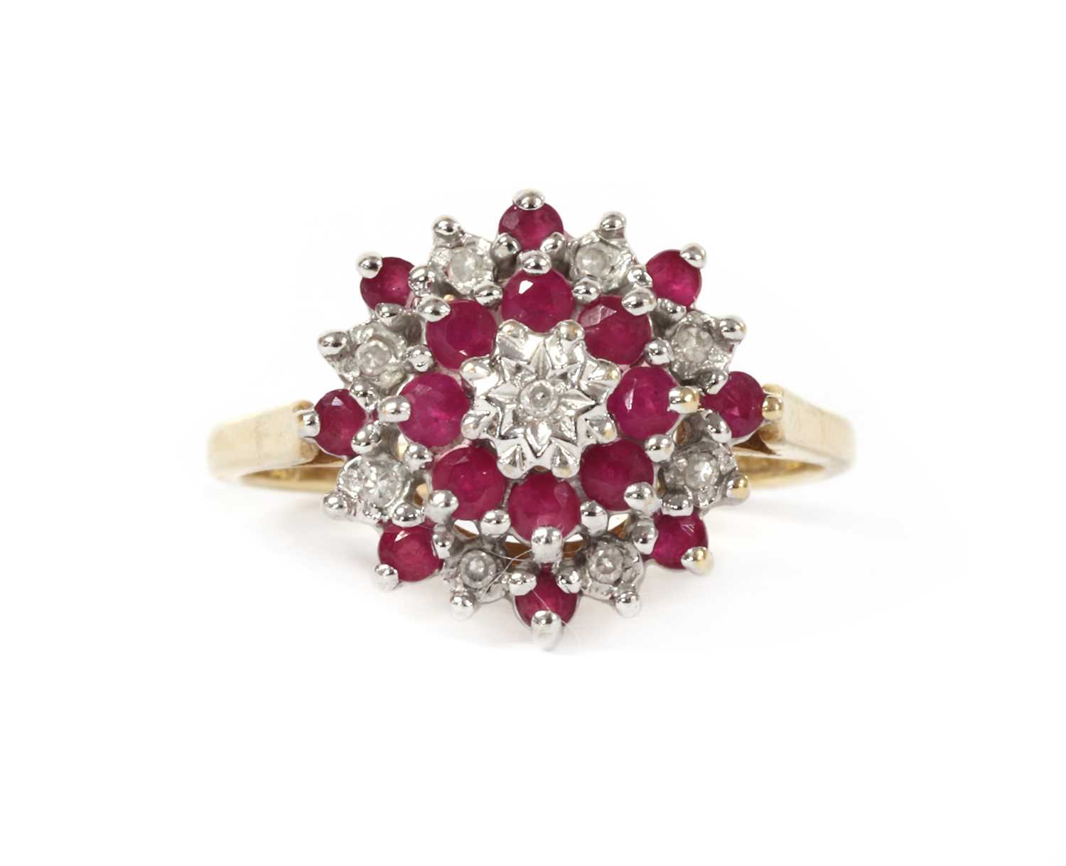 Lot 1221 - A 9ct gold diamond and ruby target cluster ring