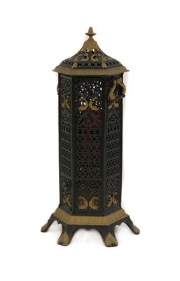 Lot 610 - A Gothic Revival wrought iron and gilt veritas stove