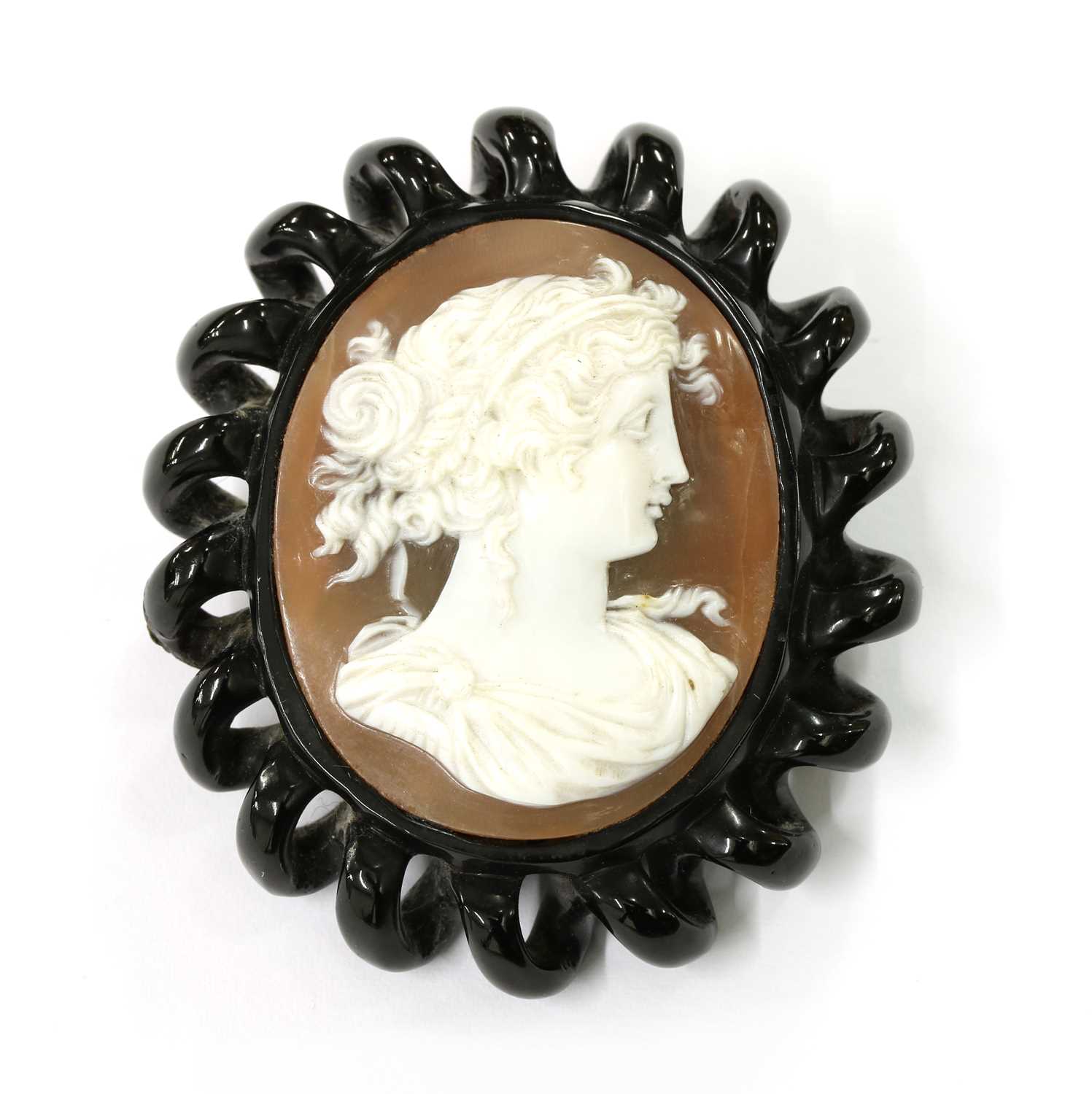 Lot 30 - A jet cameo brooch/pendant
