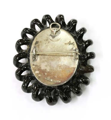 Lot 30 - A jet cameo brooch/pendant