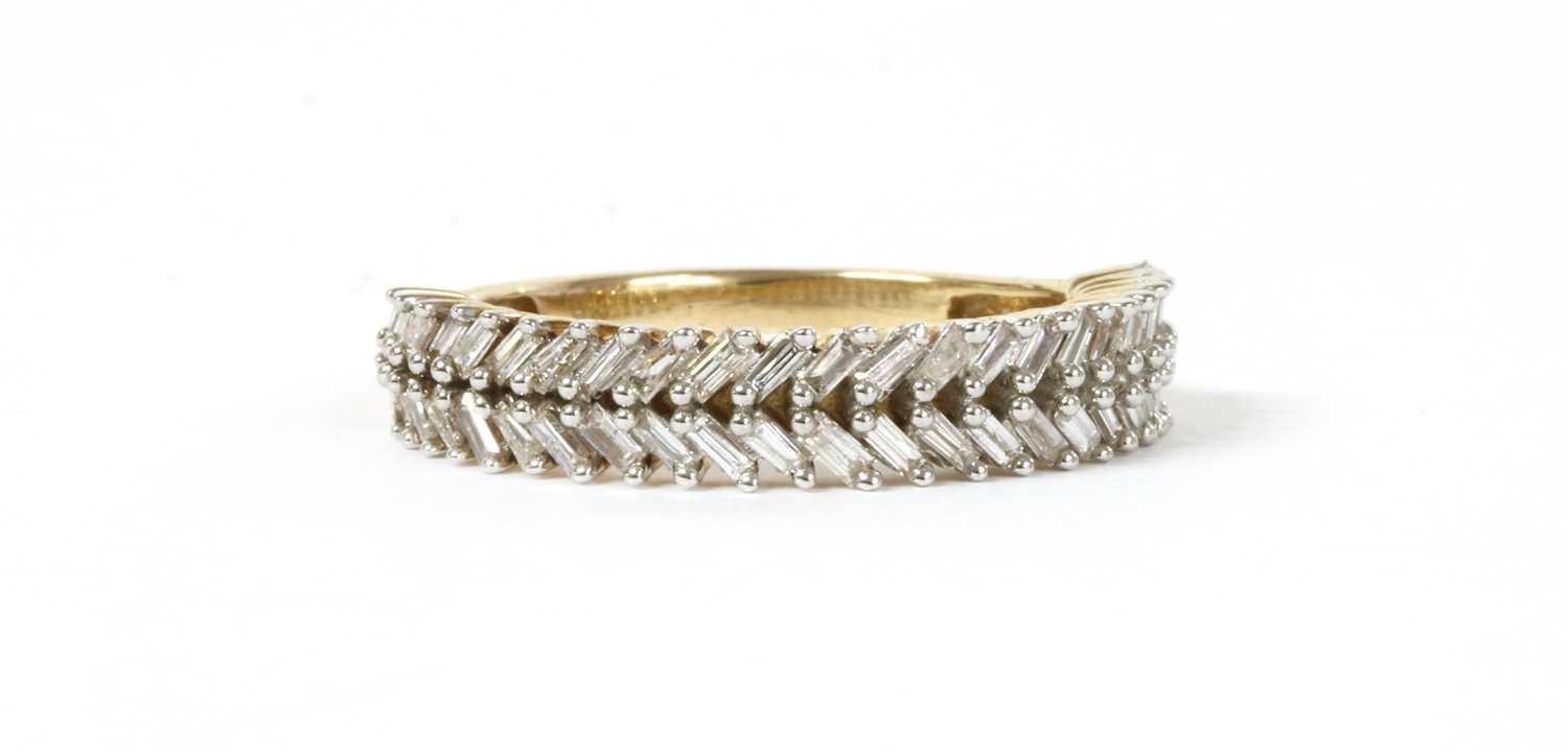 Lot 133 - A gold baguette cut diamond ring