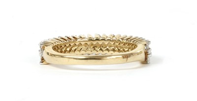 Lot 133 - A gold baguette cut diamond ring