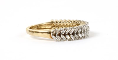 Lot 133 - A gold baguette cut diamond ring
