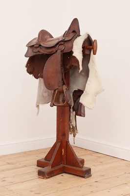 Lot 398 - A saddle and stand