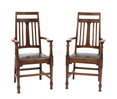Lot 412A - A pair of Arts and Crafts oak armchairs