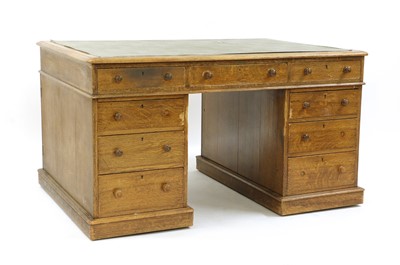Lot 427 - A Late Victorian oak pedestal partners' desk