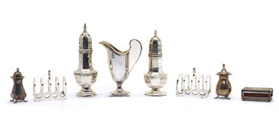 Lot 35 - A pair of silver sugar casters
