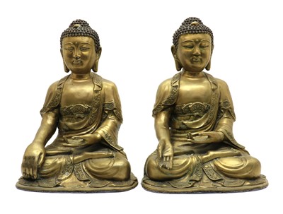 Lot 65 - A pair of Chinese brass Buddha