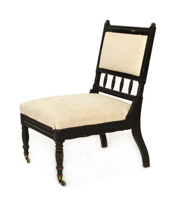 Lot 445A - An Aesthetic Movement ebonised nursing chair