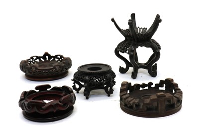 Lot 86 - A collection of Chinese wood stands
