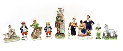 Lot 244 - A quantity of Staffordshire pottery figures