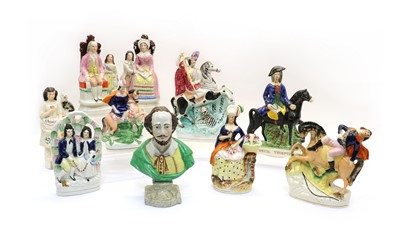 Lot 248 - A collection of Staffordshire pottery flatbacks and figures