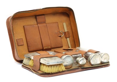 Lot 34 - A silver-mounted dressing table set