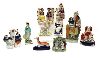 Lot 234 - A collection of Staffordshire porcelain figures