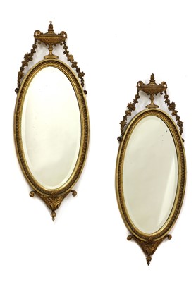 Lot 451 - A pair of gilt gesso oval wall mirrors