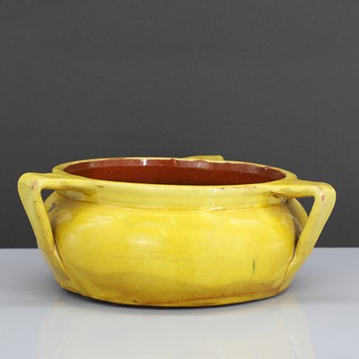 Lot 47 - A rare Liberty & Co. yellow pottery dog bowl