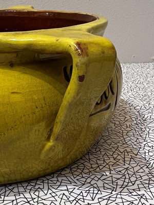 Lot 47 - A rare Liberty & Co. yellow pottery dog bowl