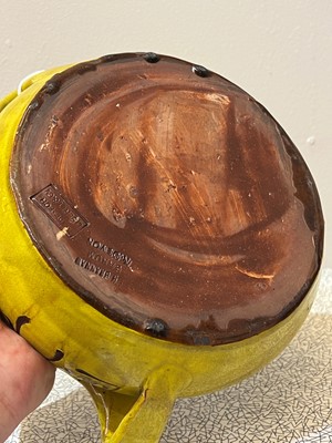 Lot 47 - A rare Liberty & Co. yellow pottery dog bowl