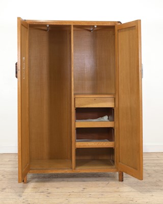 Lot 213 - A Gordon Russell crossbanded oak wardrobe