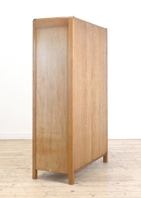 Lot 213 - A Gordon Russell crossbanded oak wardrobe
