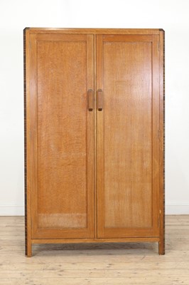 Lot 213 - A Gordon Russell crossbanded oak wardrobe