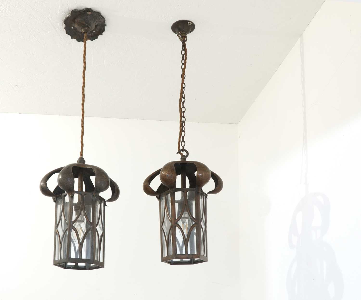 Lot 64 - A pair of Arts and Crafts copper hanging lanterns