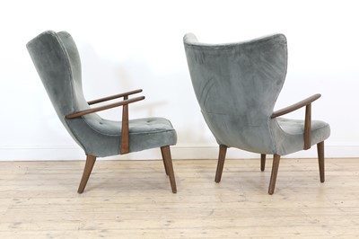 Lot 255 - A pair of upholstered wingback armchairs