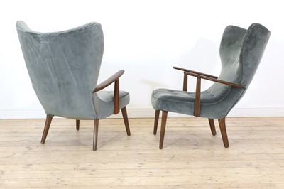 Lot 255 - A pair of upholstered wingback armchairs