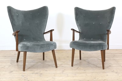 Lot 255 - A pair of upholstered wingback armchairs
