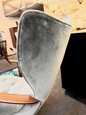 Lot 255 - A pair of upholstered wingback armchairs
