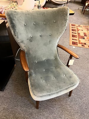 Lot 255 - A pair of upholstered wingback armchairs