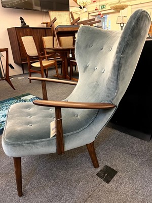 Lot 255 - A pair of upholstered wingback armchairs